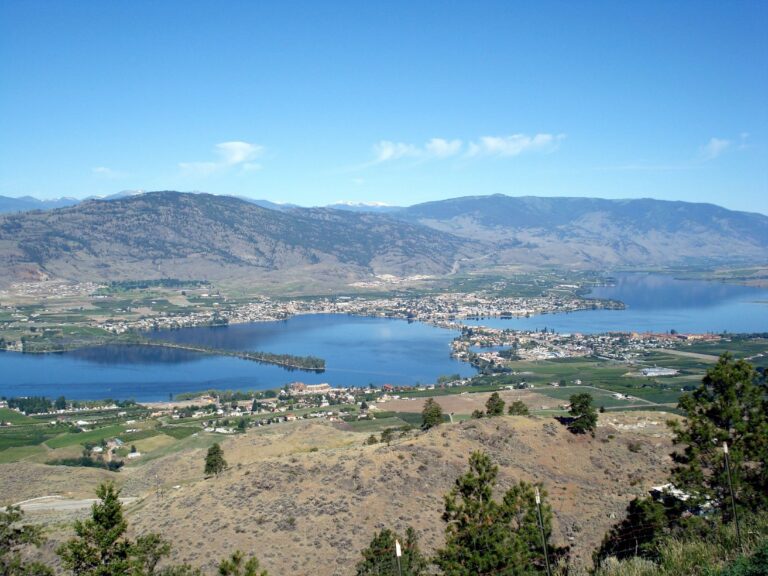 Osoyoos Lake and town seen from Anarchist Mountain Lookout, surrounded by dry hills